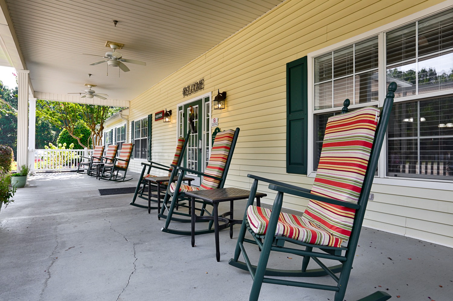 The Cottages Decatur, AL location outdoor space - front porch with rocking chairs